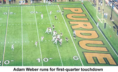 Adam Weber running for a first-quarter touchdown against Purdue